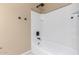 Bright bathroom featuring a shower and tub combination with neutral colors at 30303 W Whitton Ave, Buckeye, AZ 85396