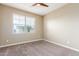 Cozy bedroom features neutral paint, plush carpeting, and a ceiling fan at 30303 W Whitton Ave, Buckeye, AZ 85396