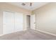 This bedroom offers a spacious closet with sliding doors and neutral color scheme at 30303 W Whitton Ave, Buckeye, AZ 85396