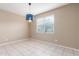 Dining room with neutral colors, tile floor, and large window, perfect for entertaining at 30303 W Whitton Ave, Buckeye, AZ 85396