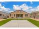 Back exterior featuring desert landscaping, artificial grass and low maintenance features at 30303 W Whitton Ave, Buckeye, AZ 85396