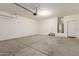 Spacious two-car garage with concrete flooring and ample storage area and water heater at 30303 W Whitton Ave, Buckeye, AZ 85396