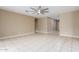 Bright, open living space with tile flooring and modern ceiling fan at 30303 W Whitton Ave, Buckeye, AZ 85396