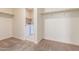 Spacious walk-in closet leading to a laundry room with a washer and dryer at 30303 W Whitton Ave, Buckeye, AZ 85396