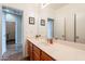 Bathroom with long countertop, cabinets, mirror and sink at 33425 N Roadrunner Ln, San Tan Valley, AZ 85144