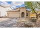 Tan single-story home showcasing a tile roof, arched entryway, and desert landscaping at 33425 N Roadrunner Ln, San Tan Valley, AZ 85144