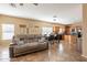 Open concept living room flows into the kitchen with cozy seating and ample natural light at 33425 N Roadrunner Ln, San Tan Valley, AZ 85144