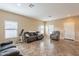 Bright living room with tile flooring, neutral paint, and plenty of natural light at 33425 N Roadrunner Ln, San Tan Valley, AZ 85144