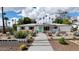 Inviting single-story home with a well-manicured yard, desert landscaping, and a charming walkway to the entrance at 4134 N 35Th St, Phoenix, AZ 85018