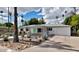 Attractive single-story house with desert landscaping, palm trees, and a welcoming driveway and walkway at 4134 N 35Th St, Phoenix, AZ 85018