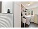 Well-organized laundry room boasting ample shelving and storage solutions alongside modern washer and dryer units at 4134 N 35Th St, Phoenix, AZ 85018