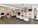 Open-concept living and dining area featuring modern decor and stylish furnishings with access to the outdoor pool and patio at 4134 N 35Th St, Phoenix, AZ 85018