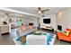 Modern living room with tile floors, an open floor plan, and access to dining and kitchen areas at 4134 N 35Th St, Phoenix, AZ 85018