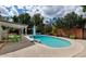 A view of the inviting pool, surrounded by lush landscaping, a covered patio, and comfortable outdoor seating at 4134 N 35Th St, Phoenix, AZ 85018