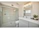 Stylish bathroom features a glass-enclosed shower and updated vanity at 4211 W Yorkshire Dr, Glendale, AZ 85308