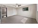 Neutral bedroom with carpet, ceiling fan and a window view at 4211 W Yorkshire Dr, Glendale, AZ 85308