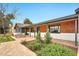 Inviting exterior with a cozy porch and beautiful landscaping, offering a serene and welcoming ambiance at 4211 W Yorkshire Dr, Glendale, AZ 85308