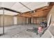 Spacious two-car garage with exposed beams and brick walls providing ample storage space and functionality at 4211 W Yorkshire Dr, Glendale, AZ 85308