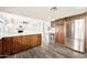 Open kitchen with granite countertops and stainless steel refrigerator at 4211 W Yorkshire Dr, Glendale, AZ 85308