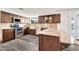 Charming kitchen with stainless steel appliances and granite countertops at 4211 W Yorkshire Dr, Glendale, AZ 85308