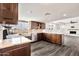 Bright kitchen with granite countertops opens to the living room at 4211 W Yorkshire Dr, Glendale, AZ 85308