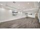 Bright living room features wood-look floors and recessed lighting at 4211 W Yorkshire Dr, Glendale, AZ 85308