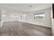 Bright open living space featuring modern tile floors, white walls, recessed lighting, and a cozy atmosphere at 4211 W Yorkshire Dr, Glendale, AZ 85308
