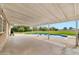 Covered patio overlooking a swimming pool and a large grass yard that's perfect for outdoor enjoyment at 4211 W Yorkshire Dr, Glendale, AZ 85308
