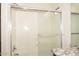 Bathroom featuring glass enclosed shower/tub and granite countertop vanity at 43857 W Bedford Dr, Maricopa, AZ 85138