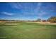 Well-maintained golf course with green fairways and mature landscaping at 43857 W Bedford Dr, Maricopa, AZ 85138