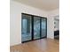 Minimalist bedroom with hardwood floors and floor-to-ceiling windows leading to outdoor space at 4550 E Foothill Dr, Paradise Valley, AZ 85253