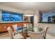 Elegant dining room with a glass table and a built-in aquarium view, perfect for sophisticated entertaining at 4550 E Foothill Dr, Paradise Valley, AZ 85253