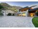 Expansive paver driveway leading to a modern home with mountain views and landscaping at 4550 E Foothill Dr, Paradise Valley, AZ 85253
