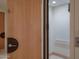Interior elevator with a light wood door and light tan and white interior at 4550 E Foothill Dr, Paradise Valley, AZ 85253