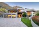 Stunning modern home featuring a unique architectural design, a spacious driveway, and lush landscaping at 4550 E Foothill Dr, Paradise Valley, AZ 85253