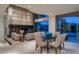 Bright living room featuring a stone wall accent, a dining area, and comfortable seating at 4550 E Foothill Dr, Paradise Valley, AZ 85253