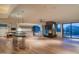 Bright living room with a fireplace, pool table and bar, offering both relaxation and entertainment options at 4550 E Foothill Dr, Paradise Valley, AZ 85253
