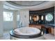 Luxurious main bathroom featuring a soaking tub, a glass shower, and elegant finishes at 4550 E Foothill Dr, Paradise Valley, AZ 85253