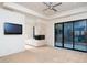 Bright main bedroom with fireplace, private bath, and large glass doors to the patio at 4550 E Foothill Dr, Paradise Valley, AZ 85253