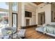 Bright main bedroom showcasing a fireplace, high ceilings, and elegant, comfortable furniture at 4550 E Foothill Dr, Paradise Valley, AZ 85253