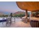Sweeping mountain views from this outdoor patio with dining and lounge seating, fire pit, and covered ceiling at 4550 E Foothill Dr, Paradise Valley, AZ 85253