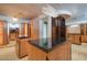 Expansive walk-in closet with custom storage, a central island, and elegant lighting at 4550 E Foothill Dr, Paradise Valley, AZ 85253
