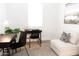 Bright home office space with desk, chair, and seating area at 4630 S 23Rd Pl, Phoenix, AZ 85040