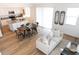 Open-concept living space with a kitchen, dining area, couch, and decorative accents at 4634 S 23Rd Pl, Phoenix, AZ 85040