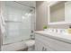 Bright bathroom with shower over tub, white vanity, and modern fixtures at 4846 E Piccadilly Rd, Phoenix, AZ 85018
