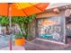 Brewery exterior featuring artistic mural, lush greenery, and a welcoming outdoor setting at 4846 E Piccadilly Rd, Phoenix, AZ 85018