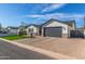 A charming single-story home has a well-maintained lawn, brick accents, and an attached two-car garage at 4846 E Piccadilly Rd, Phoenix, AZ 85018