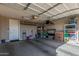 Spacious garage with ample storage, overhead racks, and organizational shelves at 4846 E Piccadilly Rd, Phoenix, AZ 85018