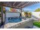 Inviting backyard hot tub with pergola, perfect for relaxation and outdoor enjoyment at 4846 E Piccadilly Rd, Phoenix, AZ 85018
