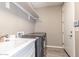 Convenient laundry room with sink, counter, washer, and dryer hook-ups, plus storage at 4846 E Piccadilly Rd, Phoenix, AZ 85018